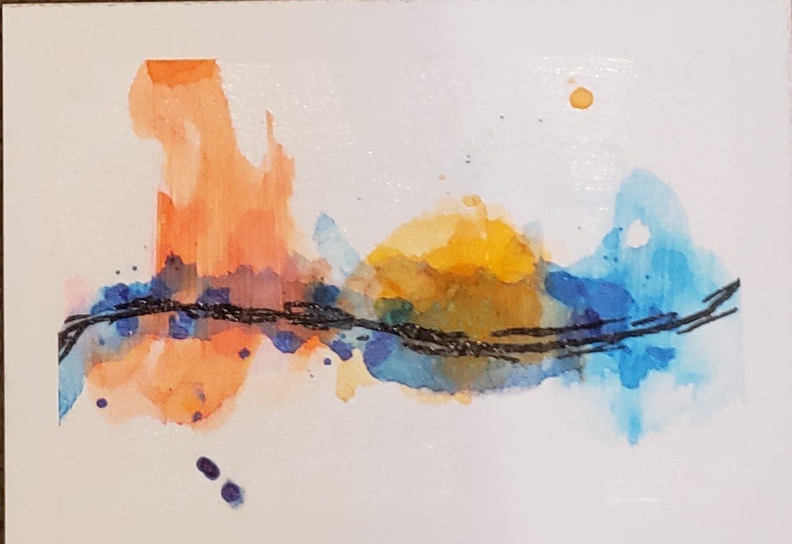 A painting of orange and blue paint on paper.