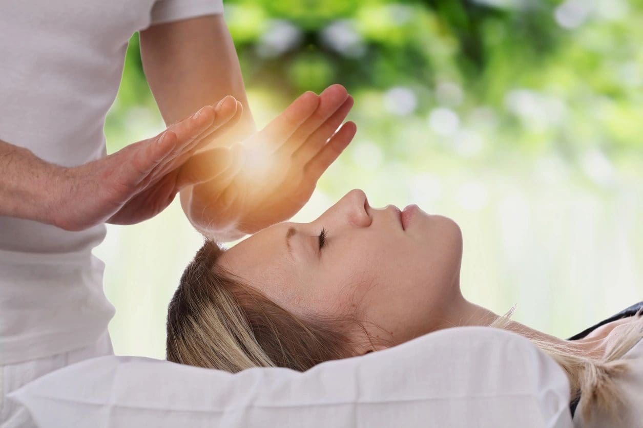 A person is being given reiki treatment