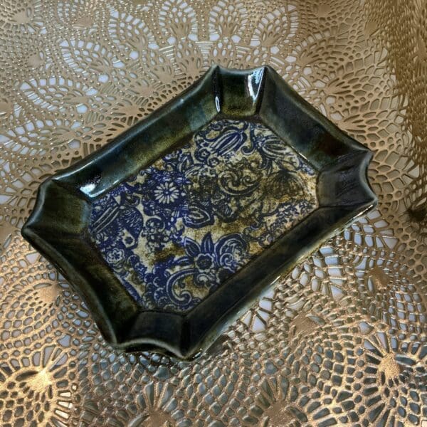 A small tray with a pattern on it