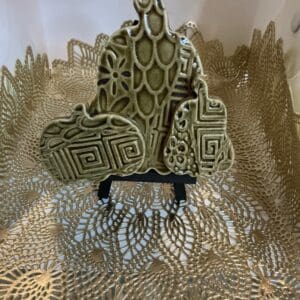 A sculpture of an animal sitting on top of a table.