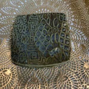 A square plate with a pattern on it