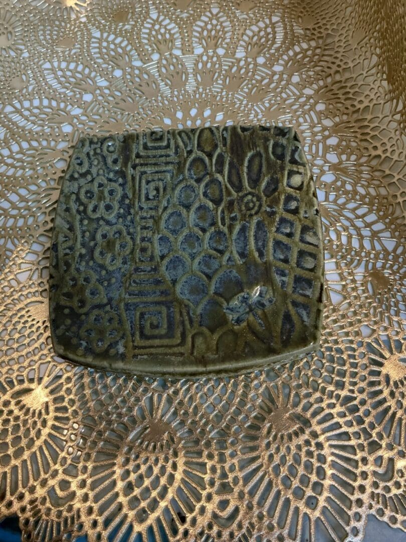 A square plate with a pattern on it