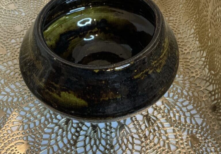 A bowl sitting on top of a table.